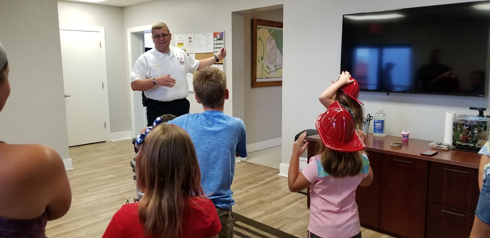 A man gives a tour to a group of children