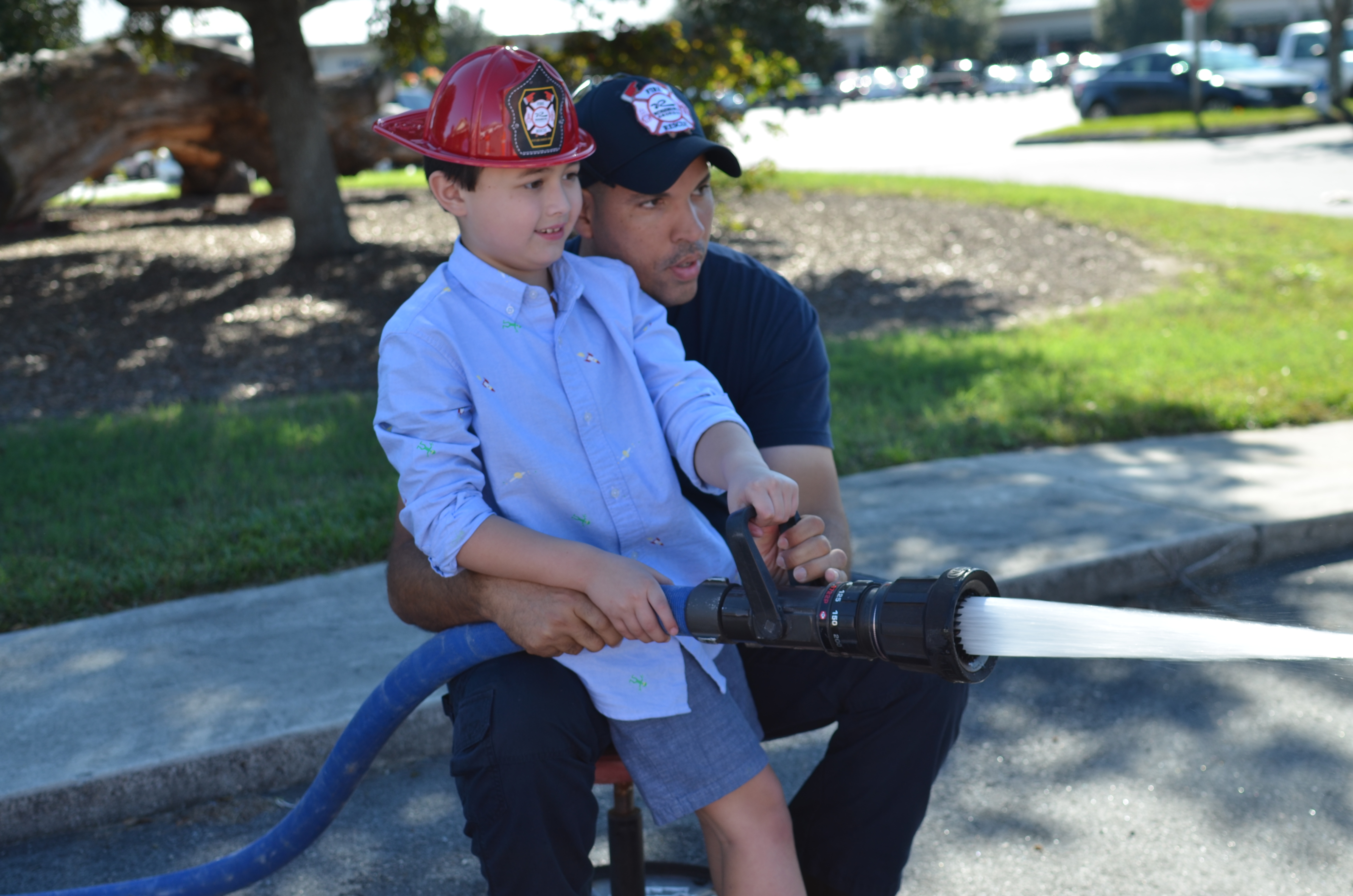 firefighter using fire hose