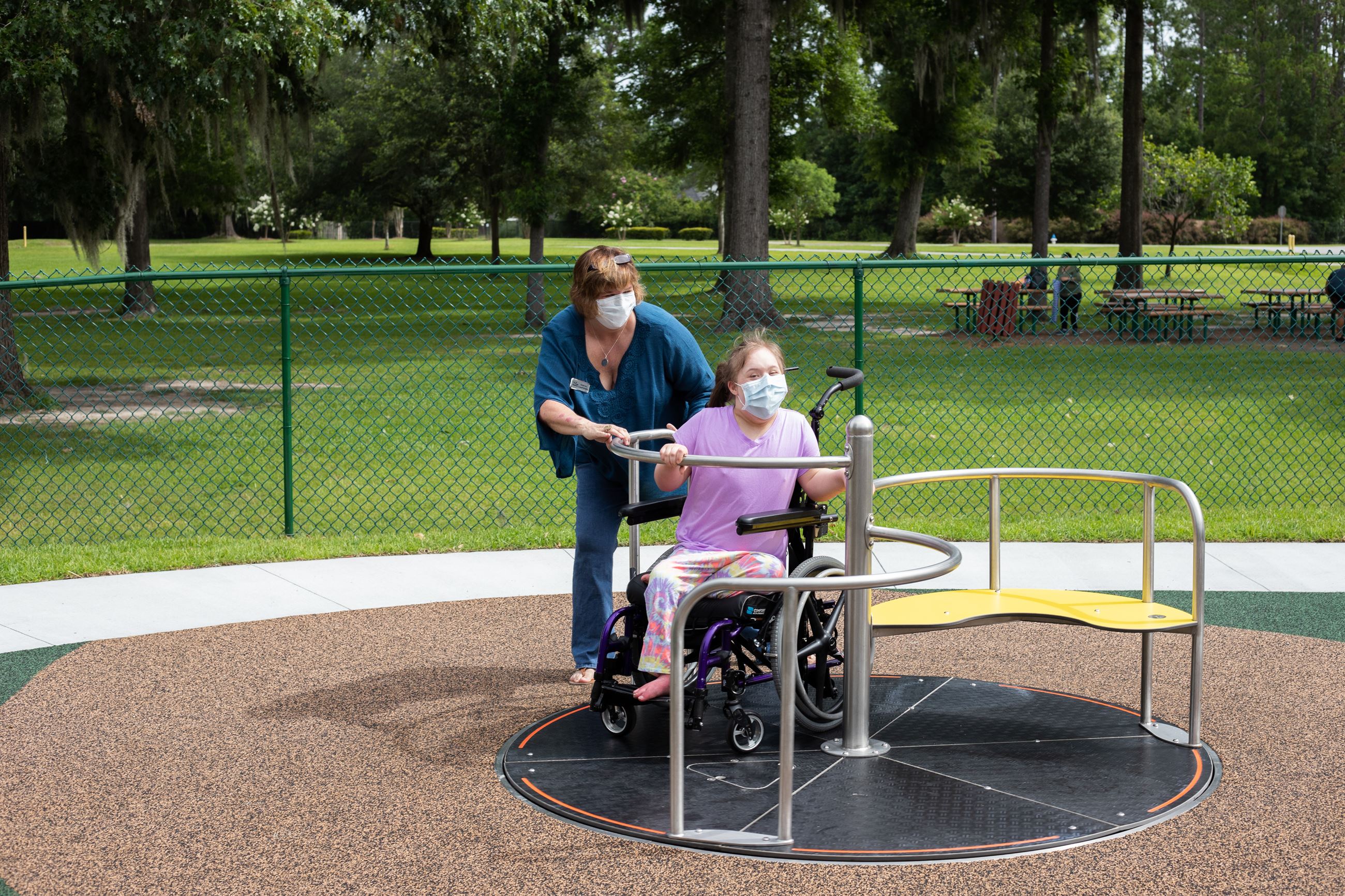 Councilmember Cox playing with her daughter in park 